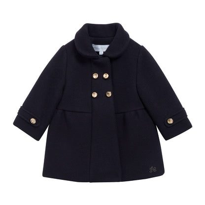 Tartine navy coat pictured on front.